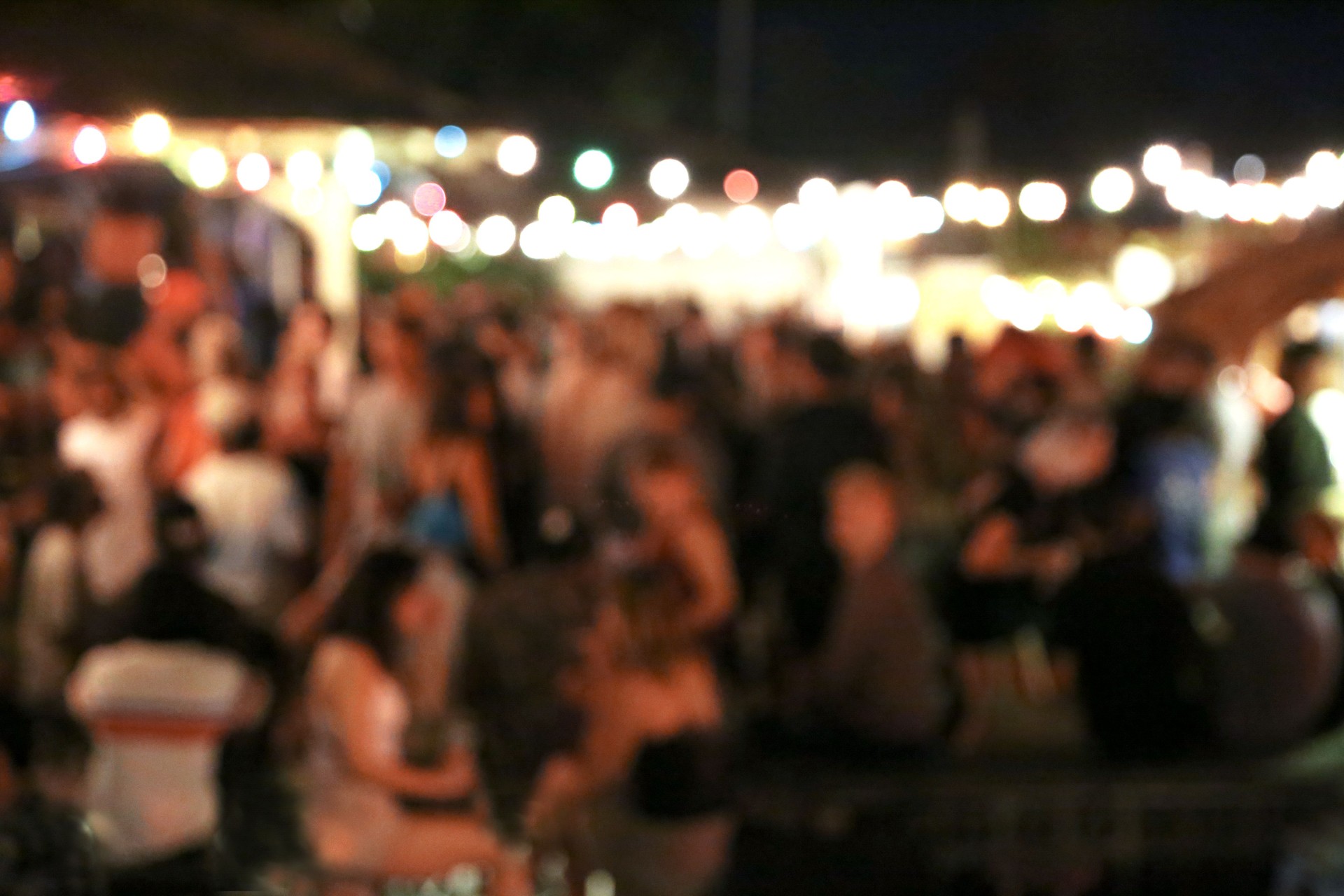 Blurred background of many people had fun at a beach party.